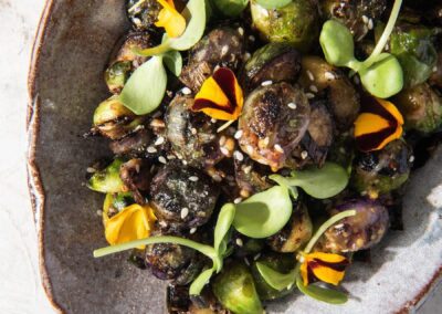 Charred Brussels Sprout and Leeks with A Coffee, Sesame, Honey Vinaigrette